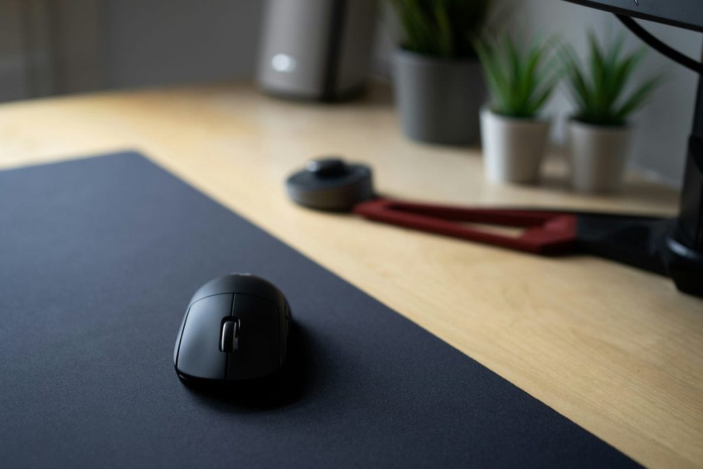 Computer mouse on a desk in a modern workspace, close-up