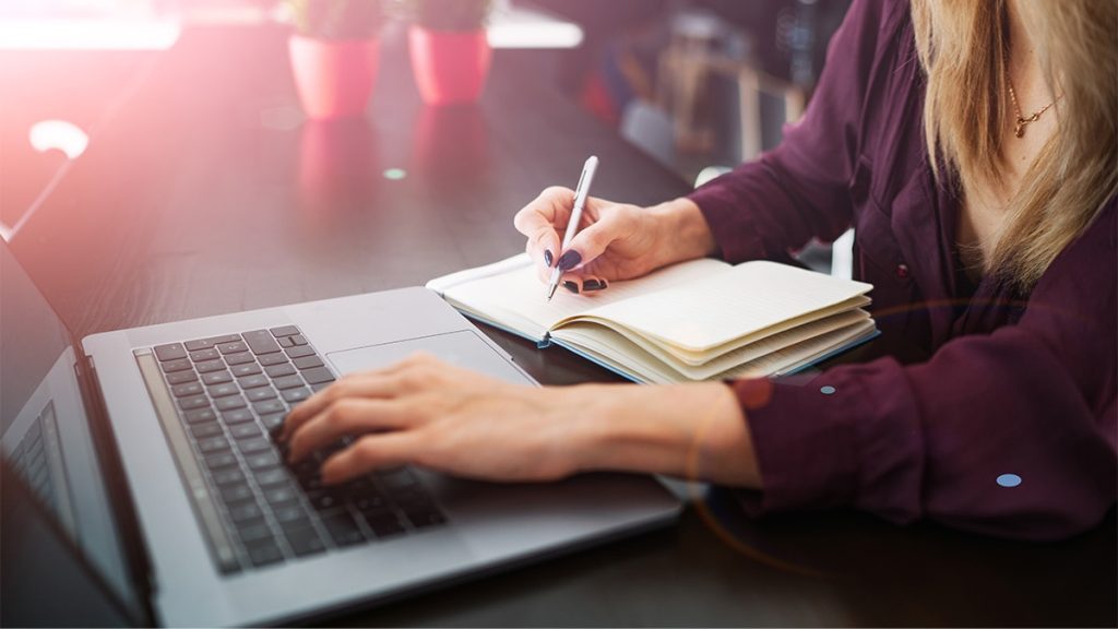 Grammarly alternative AI writing - person writing laptop notebook photography