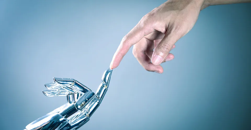 Human hand reaching toward a robot hand