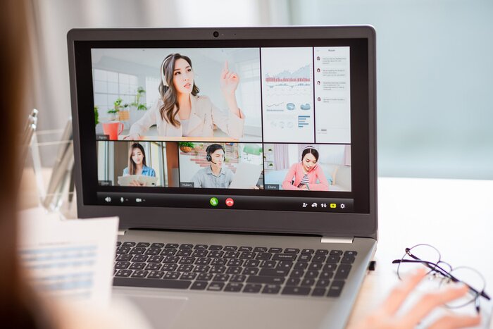 Video call on a laptop in a home office
